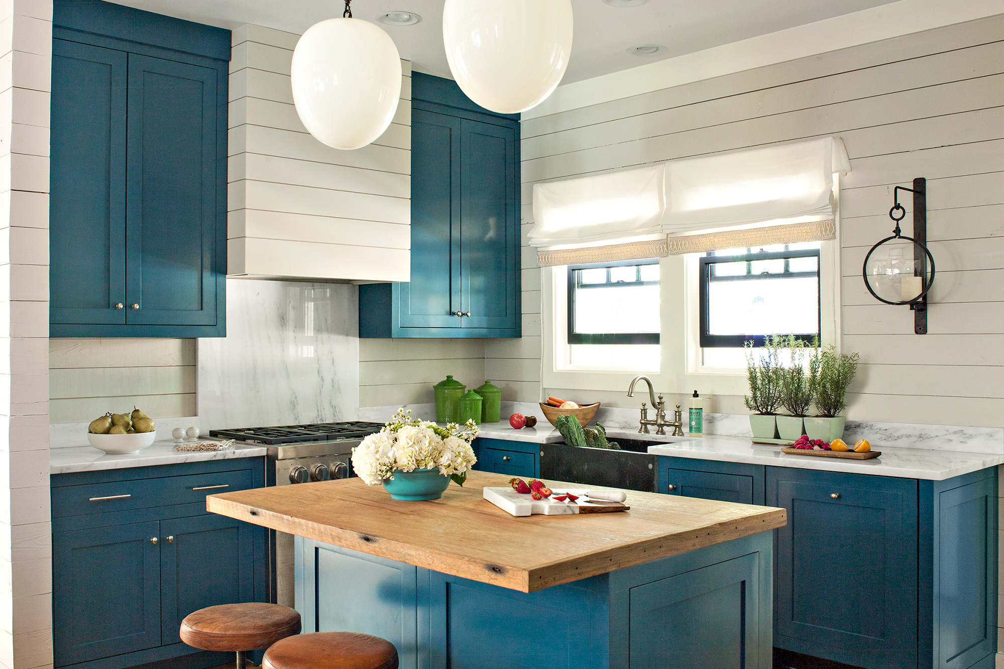 Refreshing kitchen with blue replacement kitchen cabinet doors.
